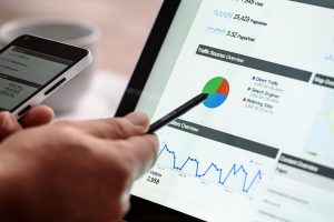 Best Treasure Coast Google Business Profile Marketing Agency a Person Using a Pen to Point at a Screen Showing Business Analytics