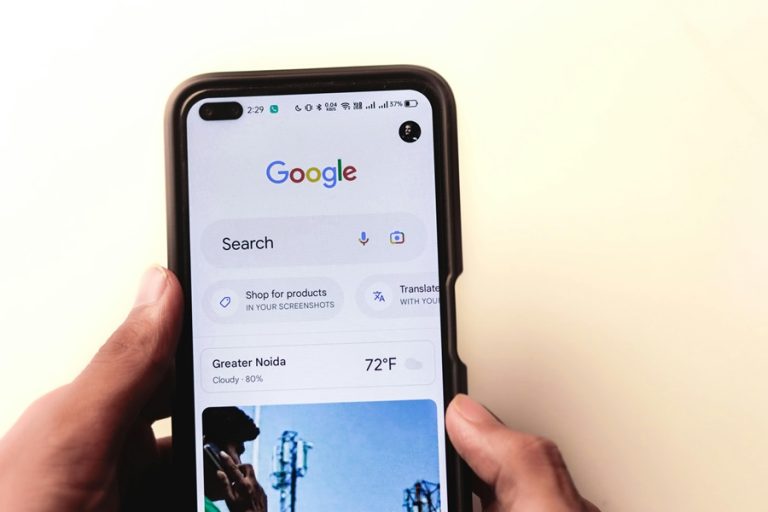 Best Google Business Profile Marketing Agency in Stuart Florida a Person Holding a Phone with Google on the Display