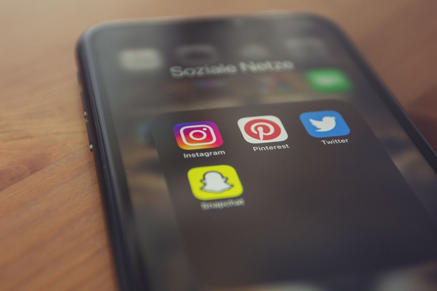 Best Small Business Marketing Services in Treasure Coast a Smartphone with Social Media Apps on the Display