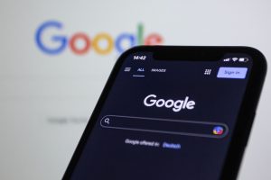 Best Small Business Marketing Services in Treasure Coast Close Up of a Smartphone with Google on the Display