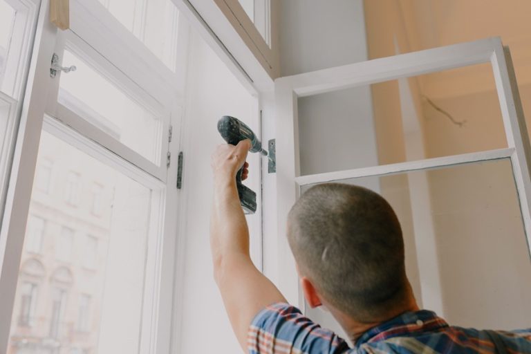 Home Services Marketing in Palm City Florida a Man Using a Drill to Screw in a Window