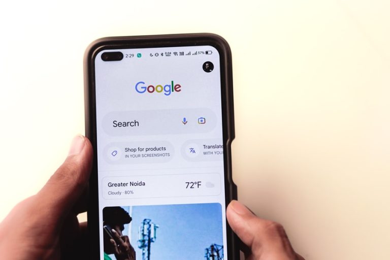 Best Google Business Profile Digital Marketing in Port Salerno Florida a person holding a smartphone with Google on the display