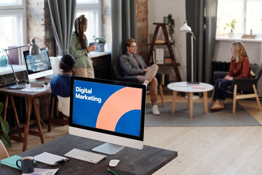 Best SEO Services for Sewalls Point a Computer Screen That Says Digital Marketing with People Sitting in the Background Behind the Computer