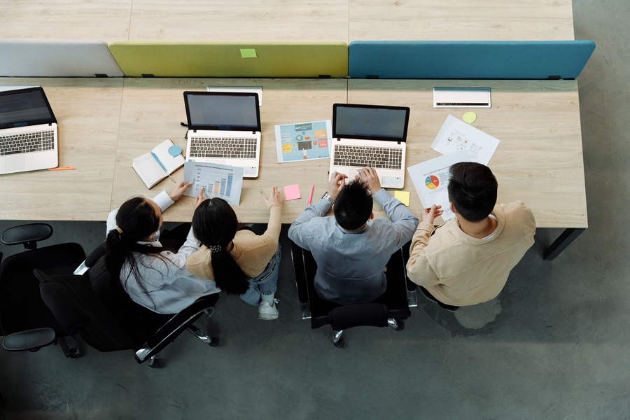 Best SEO Services for Sewalls Point People Sitting at a Long Desk with Computers on it