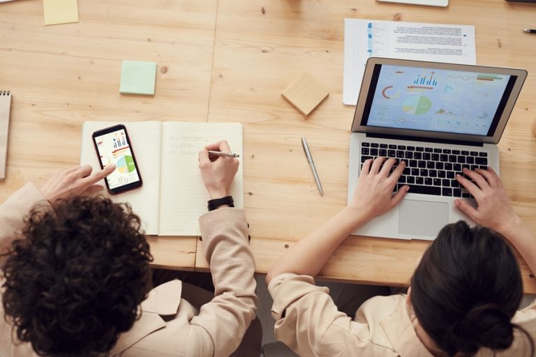 Best SEO Services for Sewalls Point Overhead View of Two People Working at Laptops at a Desk