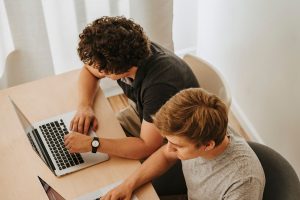 Best SEO Services in Treasure Coast Two Men Sitting at Laptops