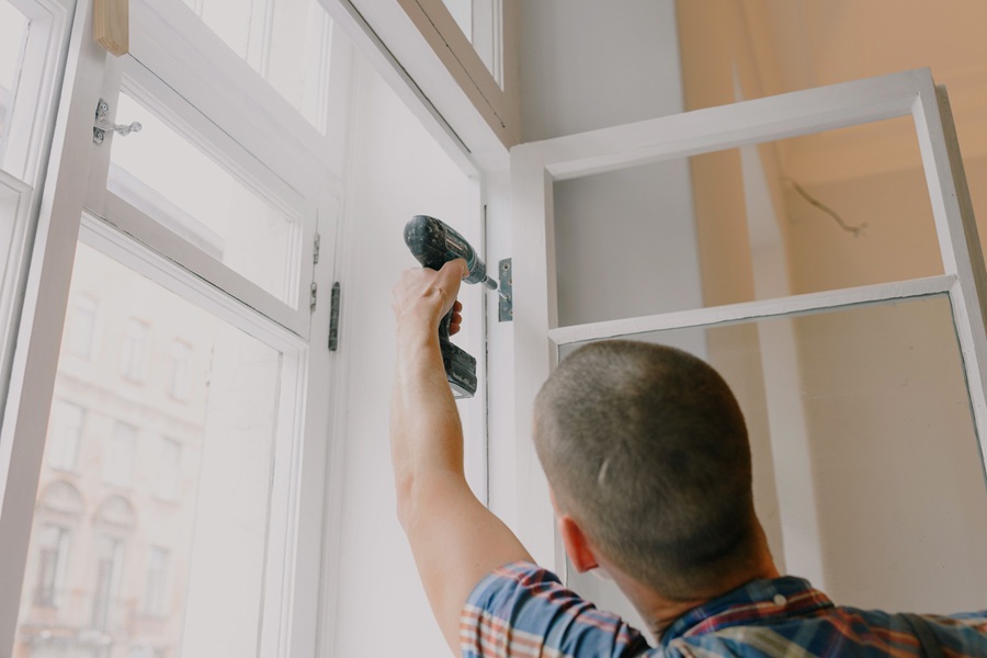 SEO Marketing for Home Service Businesses in Palm City Florida a Man Installing a Window in a Home
