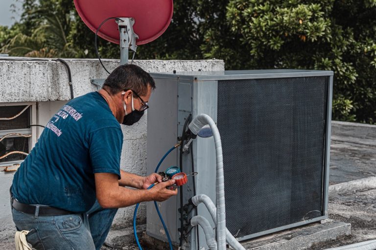 SEO Services for Trade Companies in Stuart Florida an HVAC Specialist Working on an AC Unit